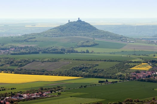 View of the ruins of Hazmburk from the top of the hill Kostalov, Czech republic.