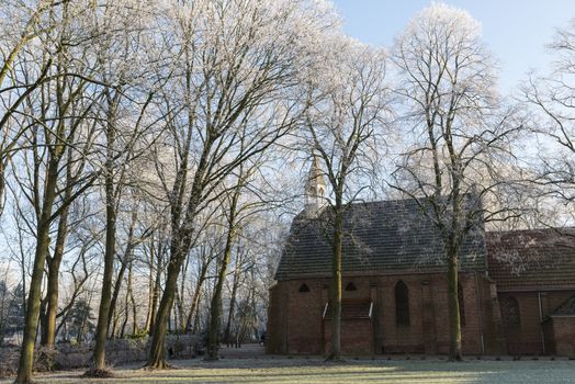 part of old monastery in holland in winter landscape in the city of Goirle