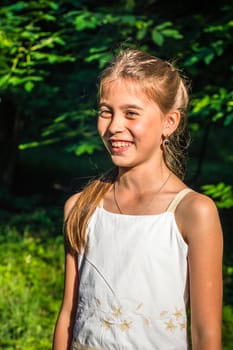 Portrait of a beautiful and happy girl in the Park