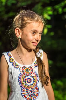 Portrait of a beautiful and happy girl in the Park