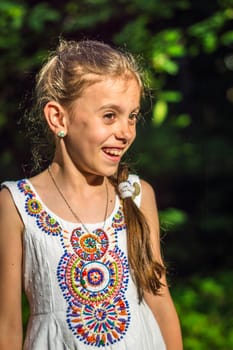 Portrait of a beautiful and happy girl in the Park