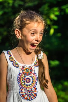 Portrait of a beautiful and happy girl in the Park