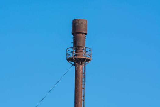 Chimney for controlled burning off of excess gas.