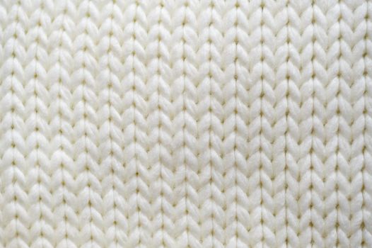 texture white knitted scarf with place for text