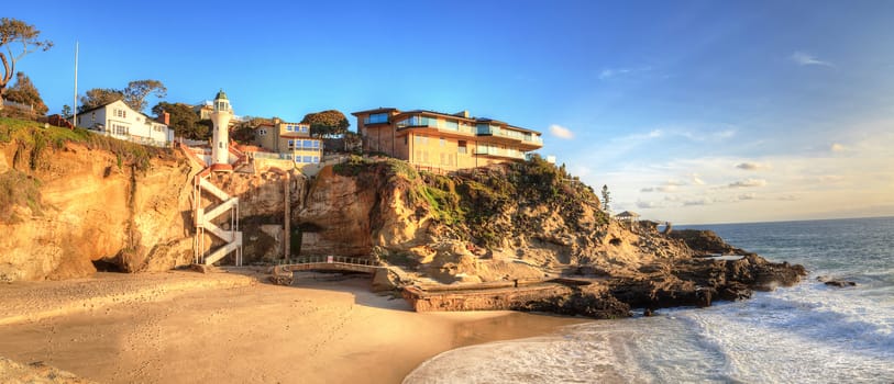 Blue sky over the coastline of One Thousand Steps Beach with tidal pools and cliffs in Laguna Beach, California, USA