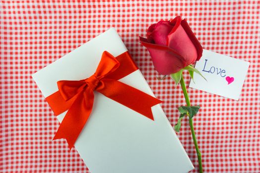 Red rose with message card. Image of Valentines day.