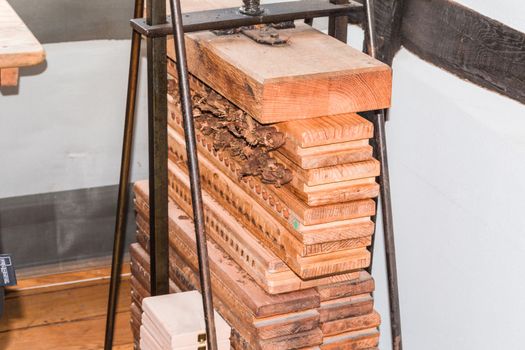 Old cigar press made of wood for pressing and drying the finished rolled cigars.