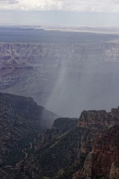 Rain pours through the Grand Canyon