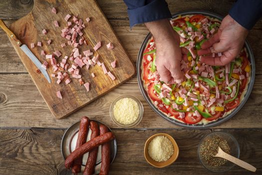 Ham, pepper, onion on the pizza horizontal