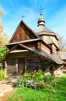 old wooden church and autumn landscape