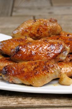 Fried sharply spicy chicken wings on a plate