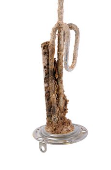  heating element of water heater with scum and sediment isolated on white background