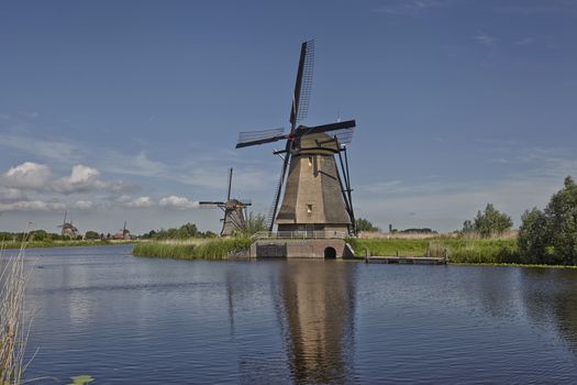 Several dutch stone brick windmills at Kinderdijk, an UNESCO world heritage site