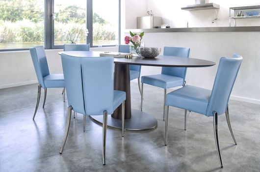 Trendy Modern Kitchen and Dinner Table with blue chairs