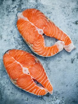 Fresh salmon fillet sliced flat lay on shabby metal background. Fresh salmon fillet sliced tempts buyers at fresh seafood stall.