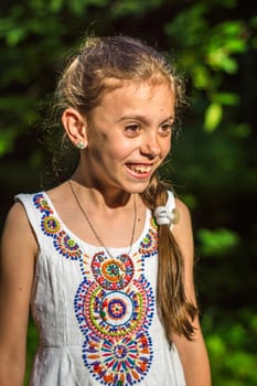 Portrait of a beautiful and happy girl in the Park