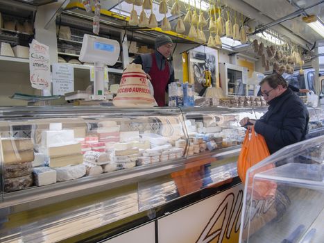 Cremona weekly street market, food, flowes, clothing and local people, winter, January 2017.