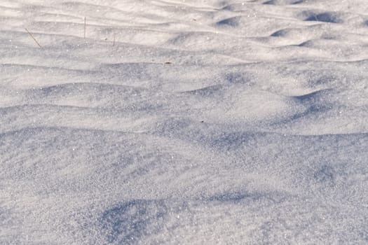 Background of fresh snow texture in warm tone