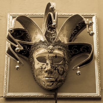 Traditional Venetian Mask on old wall background