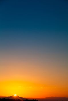 Colorful dawn over mountain in tropic location