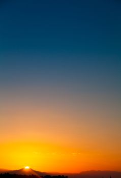 Colorful dawn over mountain in tropic location