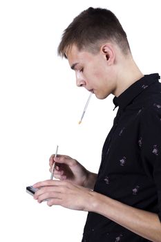 Young man makeup artist at work on a white background