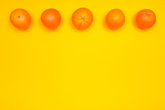 Orange pattern on orange colored background citrus arrangement