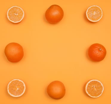 Orange pattern on orange colored background citrus arrangement