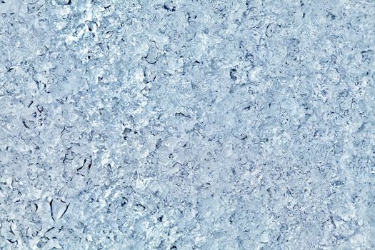 Block of blue smooth melting ice, close-up