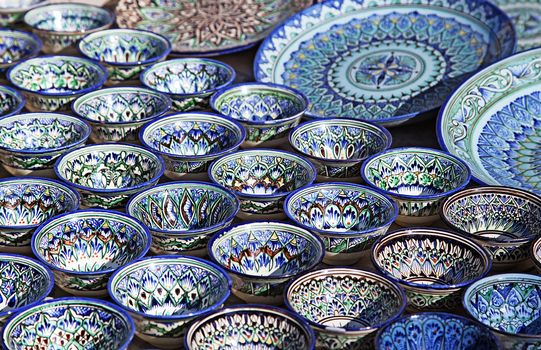 Traditional ceramic dishware in a street market, Uzbekistan