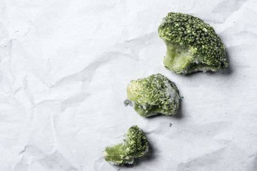 Macro close up shop of frozen broccoli veggies.