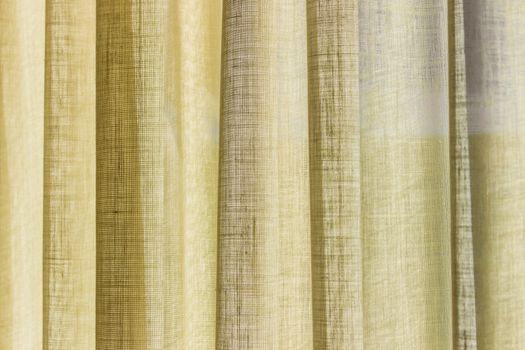 detail of the yellow curtain with folds