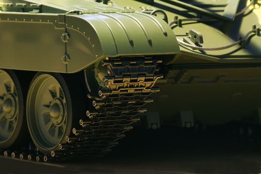 Tank tracks and steel wheels huge green panzer