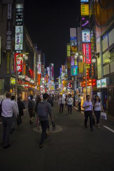 SHINJUKU TOKYO JAPAN-SEPTEMBER 11 : people and night life at  shinjuku important traveling destination and shopping area in heart of tokyo on september 11, 2015 in Tokyo Japan