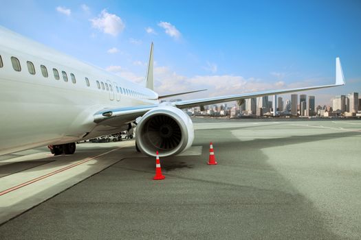 passenger plane parking in airport runway with urban scene background
