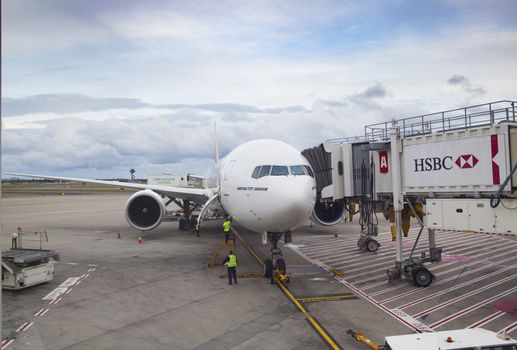 SYDNEY AUSTRALIA - SEPTEMBER 6 : boeing 777 - 300 er of emirates airline parking in Sydney (Kingsford Smith) Airport preparing departure to bangkok  on september 6 , 2015 in sydney australia