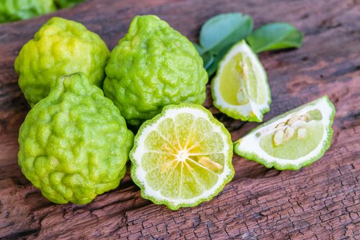 Bergamot on old wooden tables background.