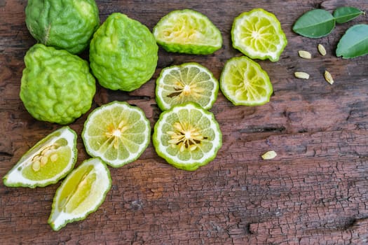 Bergamot on old wooden tables background.