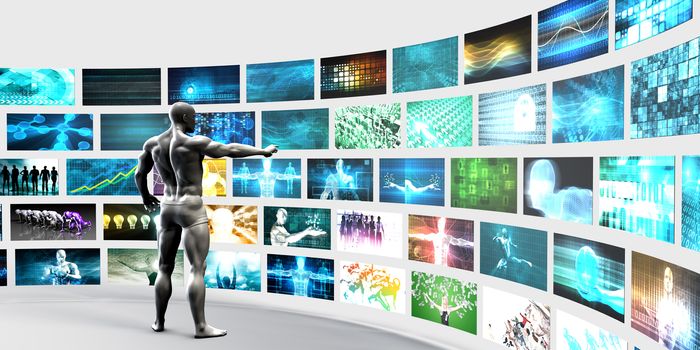 Man Pointing at a Video Wall Filled with Screens
