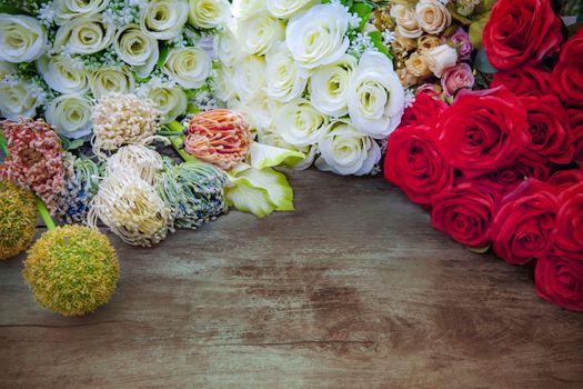 white ,red roses and flowers bouquet decor on top of wood table with free space background