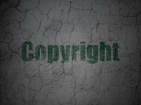 Law concept: Green Copyright on grunge textured concrete wall background