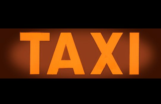 Detail Of An Orange Taxi Light Sign