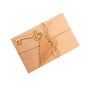 box of kraft paper and wooden heart on white background.