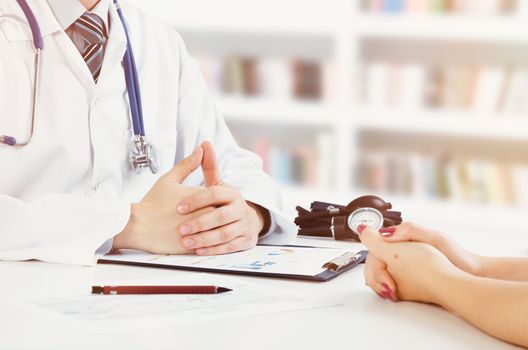Doctor and patient medical consultation. doctor patient health care office desk stethoscope medical concept