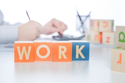 WORK word with colorful blocks. work job business leadership word cube block man concept