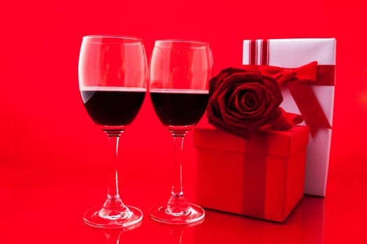 St Valentine's setting with present and red wine.