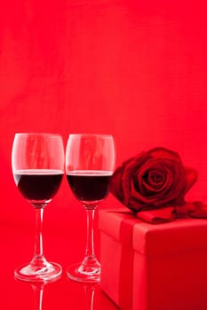 St Valentine's setting with present and red wine.