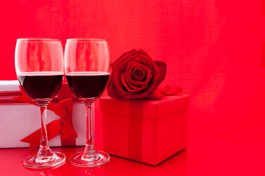 St Valentine's setting with present and red wine.