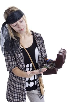 Young woman in the image of a pirate on a white background