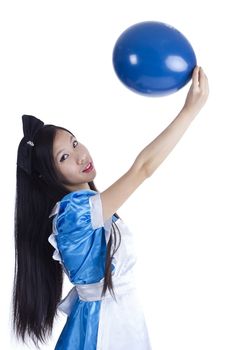 Young girl in the image of Alice with blue ball